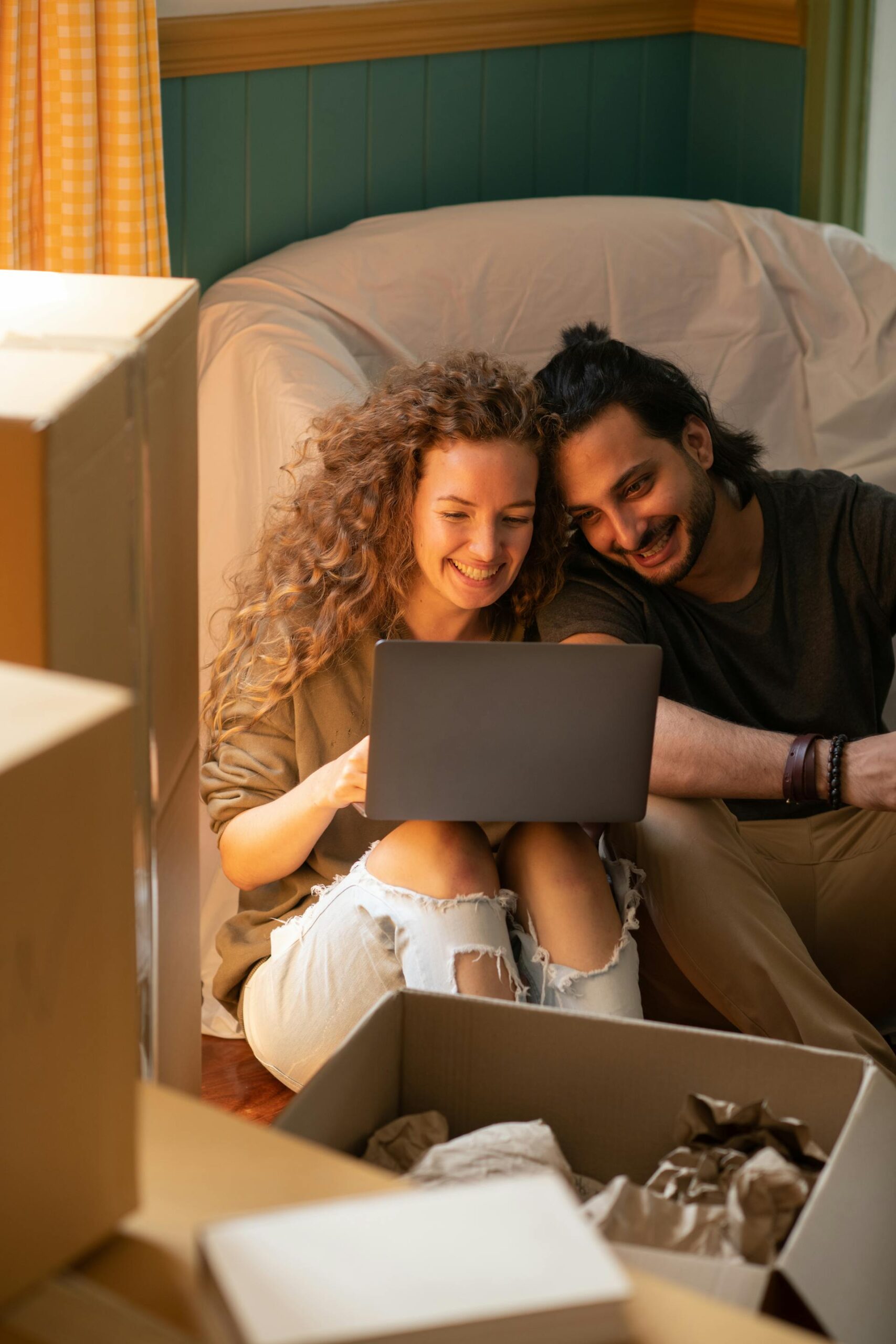 young couple looking at mortgage rates on a computer.